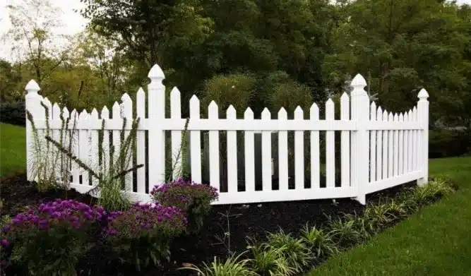 modern picket fence with dirt